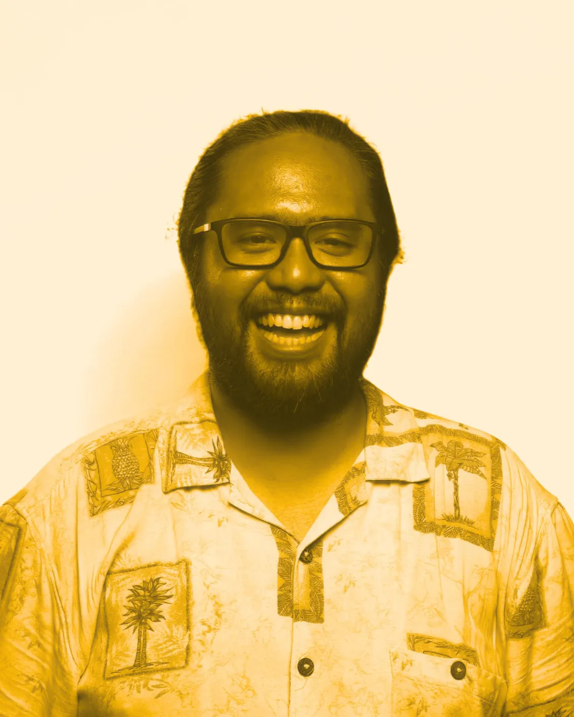 Adriansyah, co-founder of Temali Studio, in a yellow-toned portrait